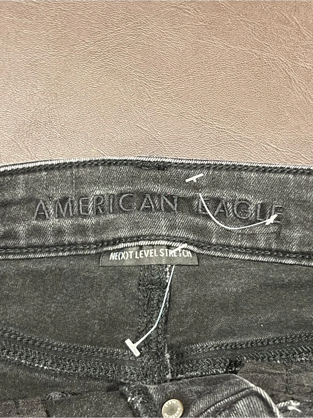 American Eagle Outfitters black denim shorts with button detail